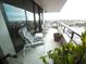 Condo balcony featuring patio furniture and views of the city at 6415 Midnight Pass Rd # 904, Sarasota, FL 34242