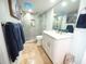 Updated bathroom features modern tile, glass shower, and white cabinets at 6415 Midnight Pass Rd # 904, Sarasota, FL 34242