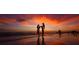Beautiful beach scene with colorful sunset at 6415 Midnight Pass Rd # 904, Sarasota, FL 34242