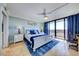 A primary bedroom with a king bed and sliding glass doors to an outdoor balcony at 6415 Midnight Pass Rd # 904, Sarasota, FL 34242