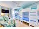 This room features two sets of built-in bunkbeds, a twin size daybed and balcony access at 6415 Midnight Pass Rd # 904, Sarasota, FL 34242