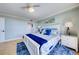 Bright bedroom featuring a white bed frame, tasteful decor, and cool-toned color palette at 6415 Midnight Pass Rd # 904, Sarasota, FL 34242