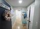 Inviting hallway with coastal decor and tiled flooring at 6415 Midnight Pass Rd # 904, Sarasota, FL 34242
