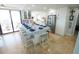 Bright, open kitchen with stainless steel appliances, large center island, and counter seating for casual dining at 6415 Midnight Pass Rd # 904, Sarasota, FL 34242