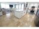 Open kitchen design with center island, stainless appliances and access to a large living room at 6415 Midnight Pass Rd # 904, Sarasota, FL 34242