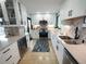 Modern kitchen with stainless steel appliances, granite countertops, and a stylish backsplash at 6415 Midnight Pass Rd # 904, Sarasota, FL 34242