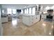 Well-appointed kitchen with a large island, ample storage, modern appliances, and an open view to the living area at 6415 Midnight Pass Rd # 904, Sarasota, FL 34242