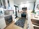 Well-appointed kitchen featuring stainless steel appliances, sleek white cabinetry, wine cooler, and stylish backsplash and flooring at 6415 Midnight Pass Rd # 904, Sarasota, FL 34242
