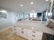 Kitchen featuring an open layout with granite countertops, travertine floors, and seamlessly transitioning into the living area at 6415 Midnight Pass Rd # 904, Sarasota, FL 34242