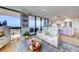 Comfortable seating area with ocean views through floor-to-ceiling windows, plus an easy transition to kitchen dining at 6415 Midnight Pass Rd # 904, Sarasota, FL 34242