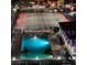 Aerial night view of the community pool and tennis courts at 6415 Midnight Pass Rd # 904, Sarasota, FL 34242
