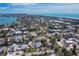 Beautiful aerial view of a coastal community with lush greenery and stunning ocean views at 660 Fox St, Longboat Key, FL 34228