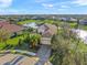 Overhead view of a beautiful home and the surrounding community, highlighting the property's layout and landscaping at 7108 Callander Cv, Lakewood Ranch, FL 34202
