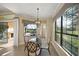 Sunlit breakfast nook with backyard and pool views at 7108 Callander Cv, Lakewood Ranch, FL 34202