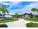 Community clubhouse entrance featuring well-manicured landscaping and attractive architectural details at 7108 Callander Cv, Lakewood Ranch, FL 34202