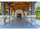 Inviting clubhouse entrance features wood beams, stone accents, and ample lighting at 7108 Callander Cv, Lakewood Ranch, FL 34202