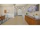 An elegant foyer with high ceilings, decorative columns, and stylish furnishings, creating a grand and welcoming entrance at 7108 Callander Cv, Lakewood Ranch, FL 34202