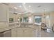Open kitchen area featuring granite countertops, stainless steel appliances, and views into the backyard at 7108 Callander Cv, Lakewood Ranch, FL 34202