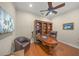 Home office with custom built-in shelving, rich wood desk, and comfortable leather chair at 7108 Callander Cv, Lakewood Ranch, FL 34202