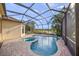 Lovely screened pool with a built-in spa and a scenic lake view providing a tranquil outdoor retreat at 7108 Callander Cv, Lakewood Ranch, FL 34202