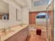 Bright bathroom featuring double sink vanity, soaking tub, and natural light at 7821 Geneva Ln # 11, Sarasota, FL 34243