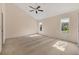 Spacious bedroom with neutral carpet, multiple windows, and vaulted ceiling at 7821 Geneva Ln # 11, Sarasota, FL 34243