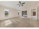 Large bedroom with carpet flooring, a ceiling fan and sliding glass doors to a patio at 7821 Geneva Ln # 11, Sarasota, FL 34243