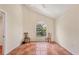 Bonus room with tile floors, arched window, and neutral paint at 7821 Geneva Ln # 11, Sarasota, FL 34243