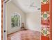 Bonus room with arched window and tile flooring at 7821 Geneva Ln # 11, Sarasota, FL 34243