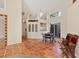Open-concept dining room with tile floors and modern lighting fixture at 7821 Geneva Ln # 11, Sarasota, FL 34243