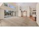 Bright living room features high ceilings, carpet flooring, and sliding glass doors to the patio at 7821 Geneva Ln # 11, Sarasota, FL 34243