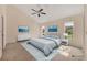 Bedroom featuring a ceiling fan and two matching pieces of artwork on the walls at 7821 Geneva Ln # 11, Sarasota, FL 34243