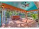 Screened outdoor spa area includes a hot tub on a brick-tiled patio, offering a relaxing retreat at 7821 Geneva Ln # 11, Sarasota, FL 34243