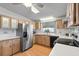 Functional kitchen featuring wood cabinets, stainless steel appliances, and ample countertop space at 788 Imperial Dr, North Port, FL 34287