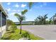 Scenic water view near the property showcasing tropical foliage, a seating area and community charm at 788 Imperial Dr, North Port, FL 34287