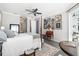 Comfortable primary bedroom featuring a four-poster bed and art collection at 8014 Planters Knoll Ter, Bradenton, FL 34201