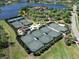 Aerial view of multiple meticulously maintained tennis courts surrounded by lush greenery at 8016 Bowspirit Way, Lakewood Ranch, FL 34202