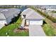 Aerial view of a well maintained home with landscaping, and paver driveway at 8192 Sternway Rd, Sarasota, FL 34240