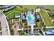 Aerial view showcases a community pool area with ample amenities and landscaping at 8192 Sternway Rd, Sarasota, FL 34240