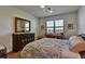 Cozy bedroom with ample natural light, hardwood floors, and a neutral color palette for relaxation at 8192 Sternway Rd, Sarasota, FL 34240