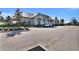 Community clubhouse with ample parking and attractive landscaping at 8192 Sternway Rd, Sarasota, FL 34240