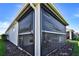 Enclosed lanai with retractable privacy screen and outdoor dining furniture at 8192 Sternway Rd, Sarasota, FL 34240