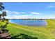 Scenic pond view showcasing lush landscaping and a tranquil atmosphere in the community at 8192 Sternway Rd, Sarasota, FL 34240