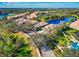 Aerial view of a residential area with scenic landscaping and water features, creating a serene and picturesque environment at 8310 Tartan Fields Cir, Lakewood Ranch, FL 34202