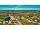 Community aerial view showcasing beautiful greenery, water features, and nearby golf course at 8310 Tartan Fields Cir, Lakewood Ranch, FL 34202