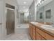 Bathroom featuring double sinks, walk-in shower and tub at 8310 Tartan Fields Cir, Lakewood Ranch, FL 34202