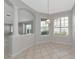 Bright dining room with large windows and decorative columns at 8310 Tartan Fields Cir, Lakewood Ranch, FL 34202