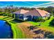 Beautiful home featuring screened lanai overlooking lush landscaping and serene pond at 8310 Tartan Fields Cir, Lakewood Ranch, FL 34202