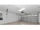 The spacious two-car garage features overhead lighting and a windowed garage door at 8310 Tartan Fields Cir, Lakewood Ranch, FL 34202