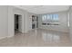 Spacious living room with large windows and tile flooring at 8310 Tartan Fields Cir, Lakewood Ranch, FL 34202